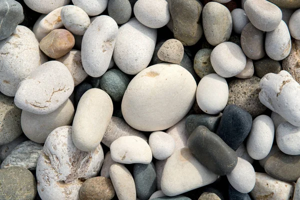 Piedras de playa fondo en el día — Foto de Stock