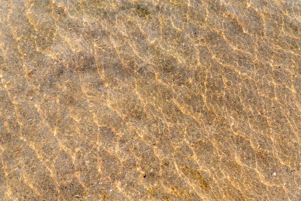 Fond d'eau de plage avec sable — Photo