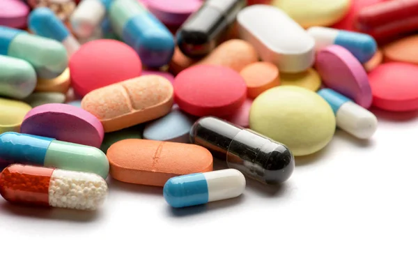 Multicolored pills on white background — Stock Photo, Image