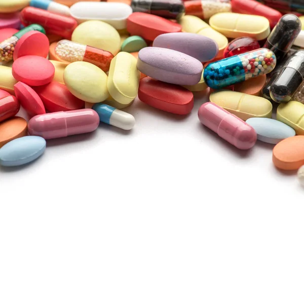 Pharmacy theme. Multicolored Isolated Pills and Capsules. — Stock Photo, Image