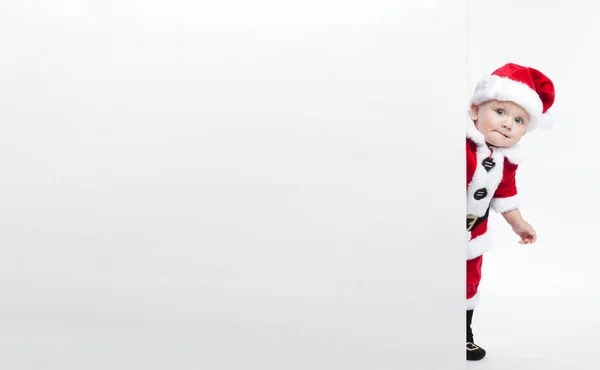 Weihnachtsmann-Baby hält weißes Werbebanner leer — Stockfoto