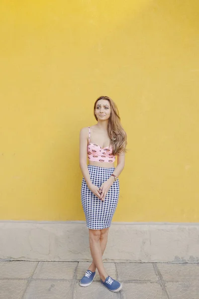 Young pretty girl posing in the street