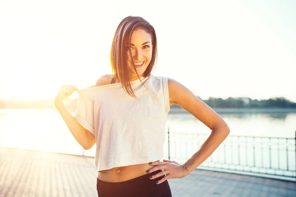 Jogger by the lake at sunset — Stock Photo, Image