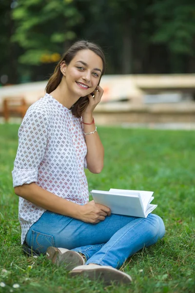 Cute young woman reading the book — Stock Photo, Image