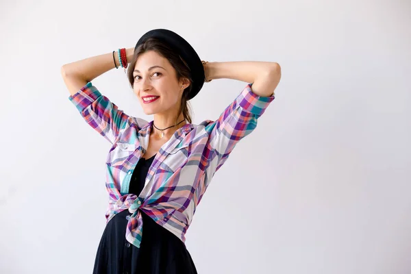 Fashionable brunette with hat studio shot — Stock Photo, Image