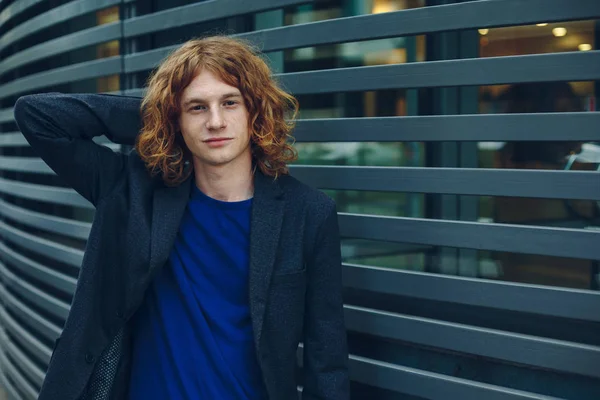 Portrait of red haired man over urban futuristic background — Stock Photo, Image