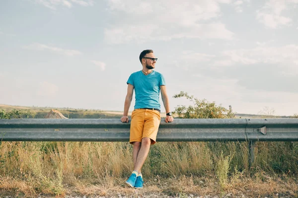 Young man smiling and enjoying sunny summer day — Stock Photo, Image