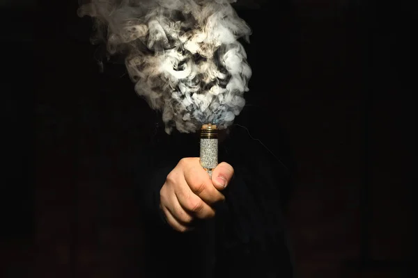 Dripper in one hand making a cloud of fume — Stock Photo, Image