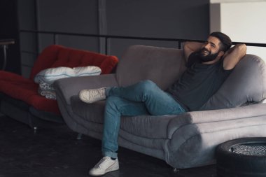 Young man sitting relaxing on the couch