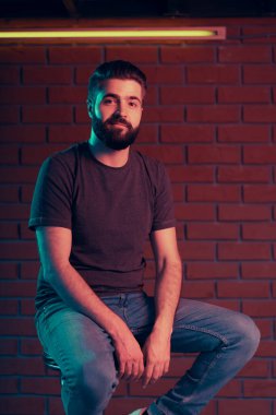 Cheerful young man in a nightclub