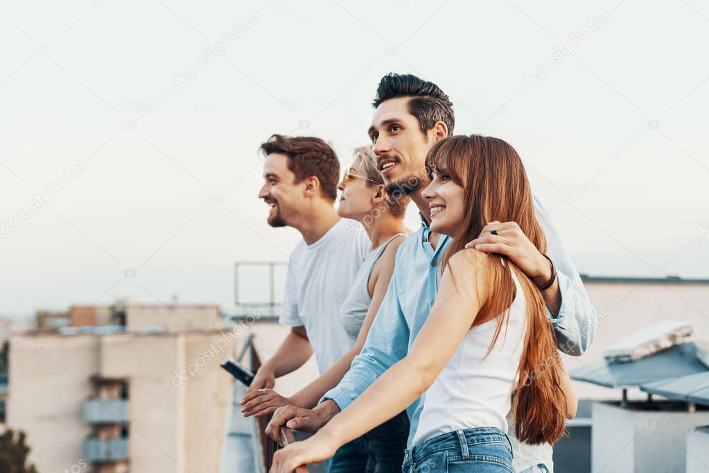 Group of friends enjoying outdoors at roof