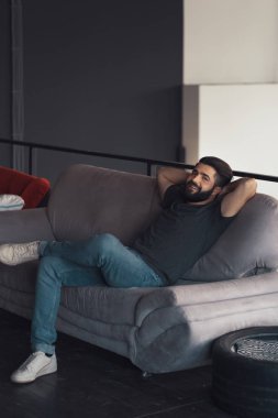 Young man sitting relaxing on the couch
