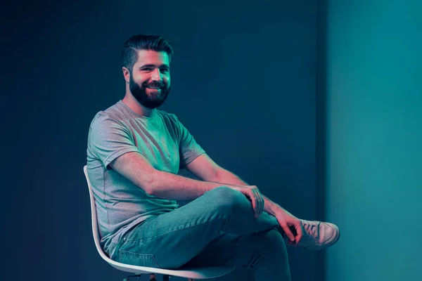 Neon portrait of a young attractive man