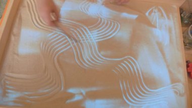 Childrens sand therapy. Childrens games with sand. Educational activities in the game room.