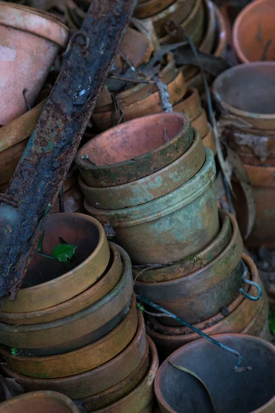 Old dirty flower pots stacked in garden — Stock Photo, Image