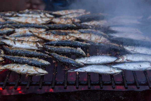 Sardines on grill on street bbq. hot tipical portugal food — Stock Photo, Image