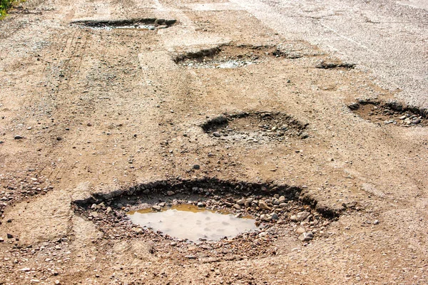 Old broken road in the village — Stock Photo, Image