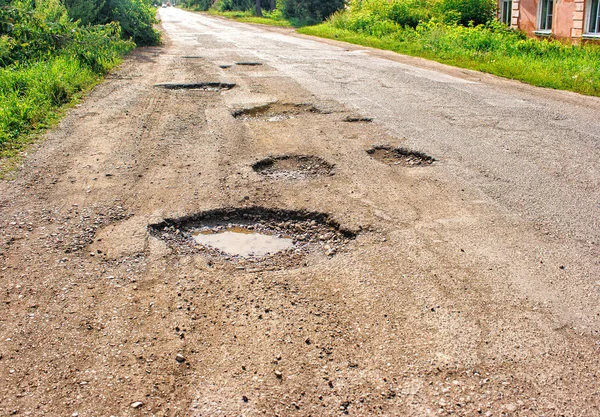 Old broken road in the village — Stock Photo, Image