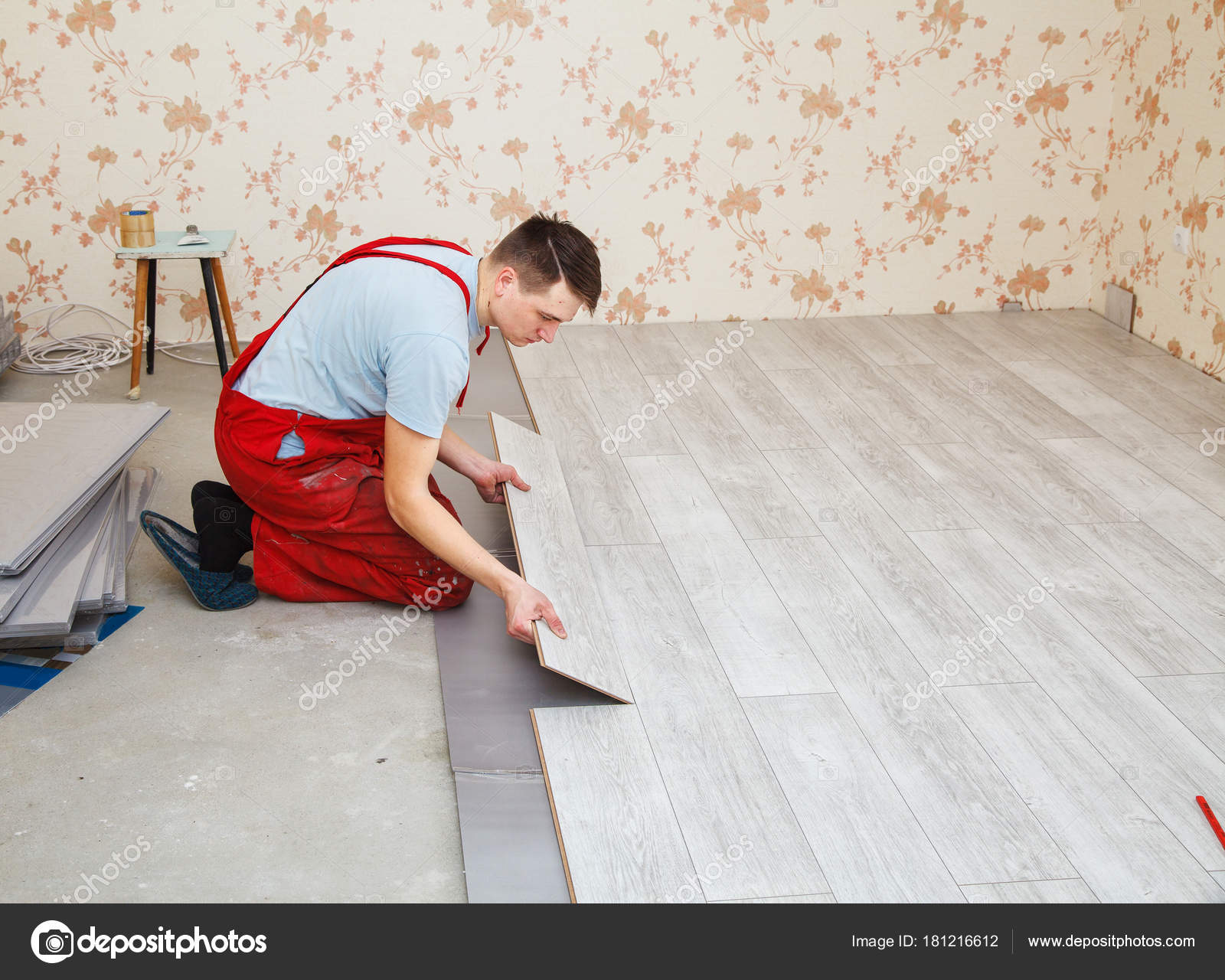 Handyman Laying Down Laminate Flooring Boards Stock Photo Handyman Laying Down Laminate Flooring Boards Stock Photo