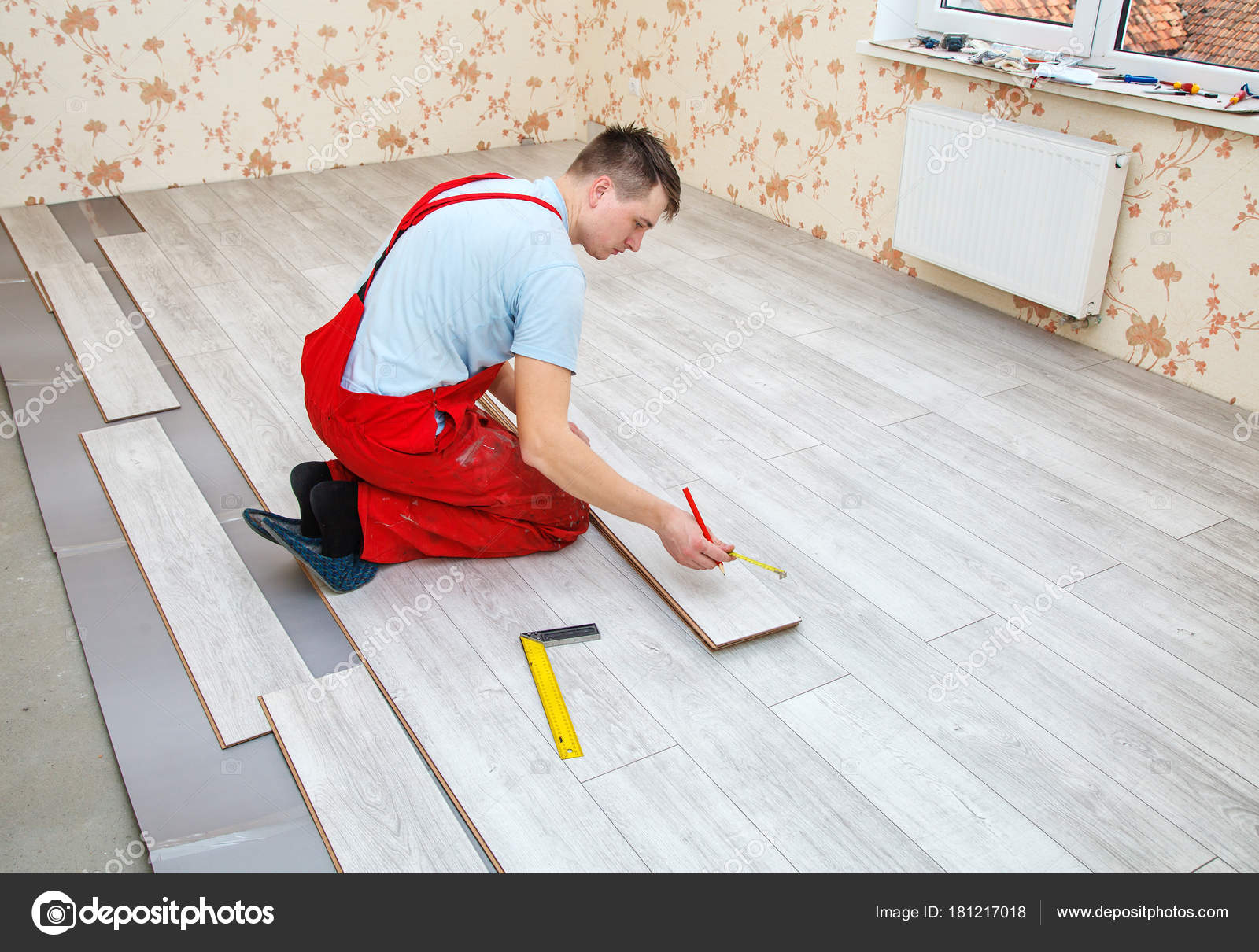 Handyman Laying Down Laminate Flooring Boards Stock Photo Handyman Laying Down Laminate Flooring Boards Stock Photo