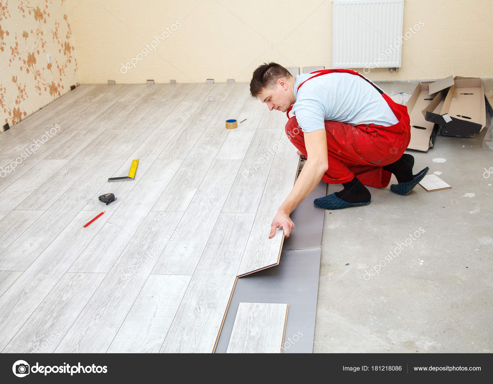 Handyman Laying Down Laminate Flooring Boards Stock Photo Handyman Laying Down Laminate Flooring Boards Stock Photo