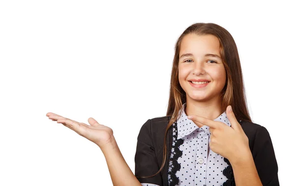 Menina adolescente surpreso mostrando um produto — Fotografia de Stock
