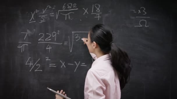 Teacher writing math formulas — Stock Video