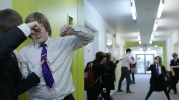 Teachers and pupils in school corridor — Stock Video