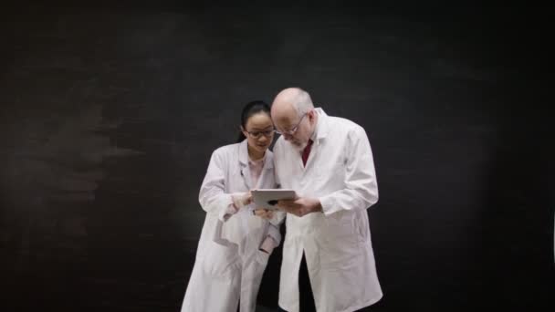 Doctors with a tablet computer — Stock Video