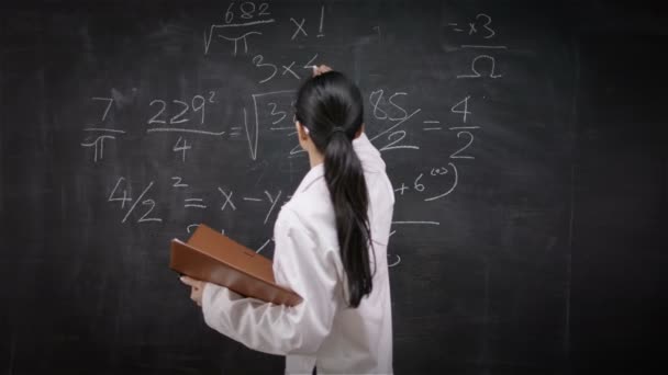 Teacher writing math formulas — Stock Video