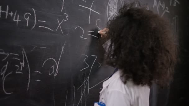 Scientist writing math formulas — Stockvideo