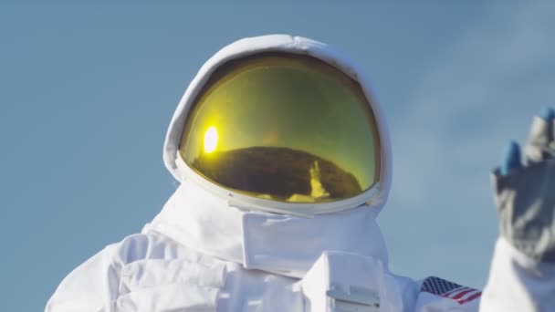 Astronaut waves to celebrate a safe landing — Stock video