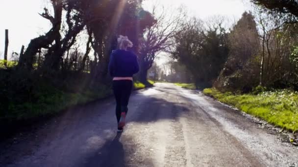 Woman stops to get her breath back — Stockvideo