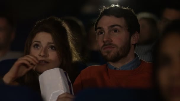 Cinema audience reacts to scary movie — Stock Video