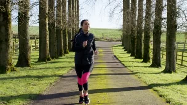 Woman stops to get her breath back — Stockvideo