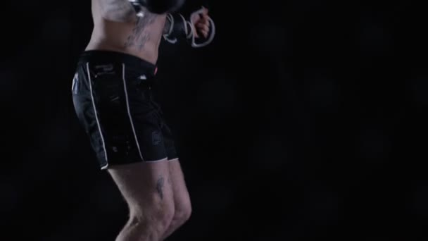 MMA fighter training with skipping rope — Stock Video