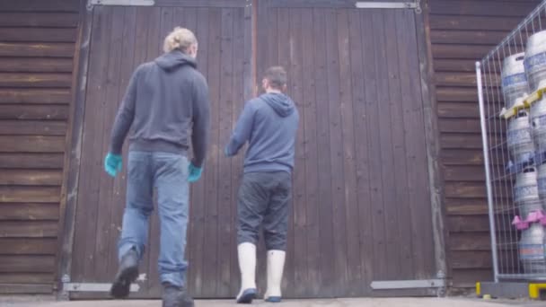 Workers opening doors to cellar — Stock Video