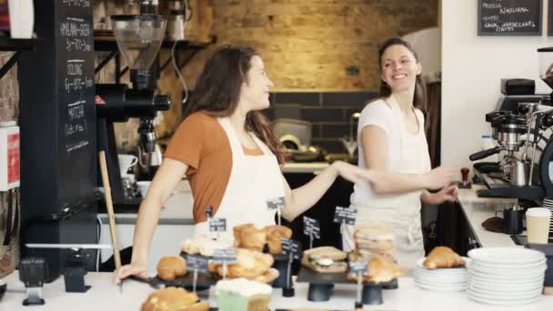 Workers standing behind counter — Stock Video