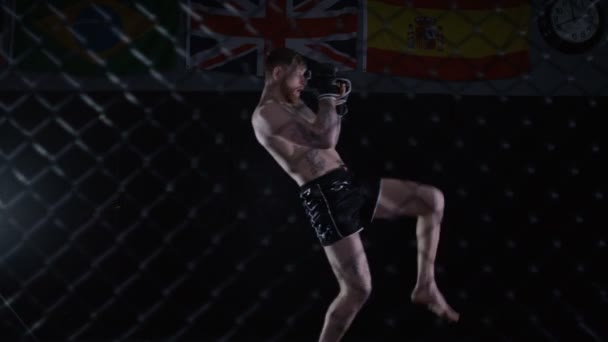 MMA fighter training in dark — Stock video