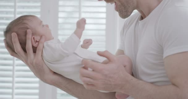 Father holding baby daughter — Stock Video