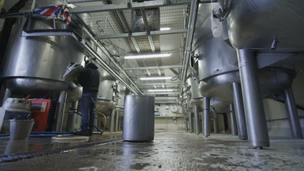 Worker cleaning out tanks — Stock Video