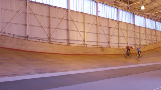 Cyclists on racing track in velodrome — Stock Video