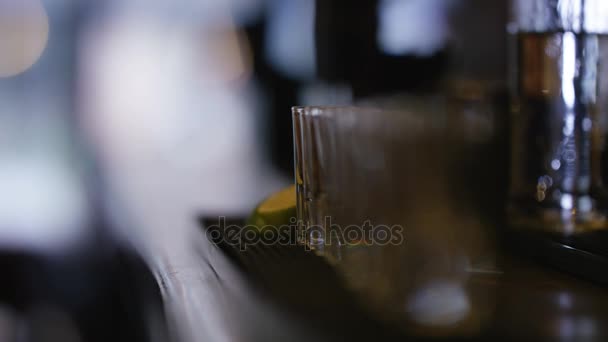 Close Barman Pouring Alcohol Row Shot Glasses — Stock Video