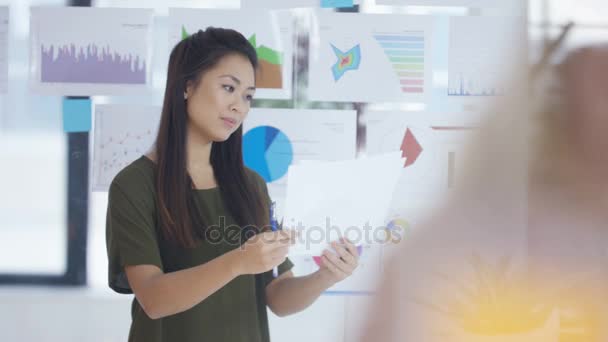 Businesswoman Looking Papers Front Screen Charts Graphs — Stock Video