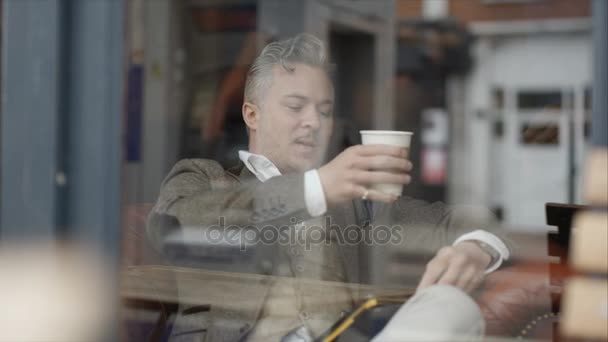 Pensive Man Sitting Alone Cafe Looking Computer Tablet — Vídeo de stock