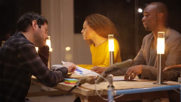 Business Team Working Late Computer Screen Papers Showing Charts Graphs — Stock Video