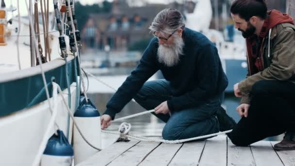 Father Son Chatting Jetty While Mooring Boat — Stock Video