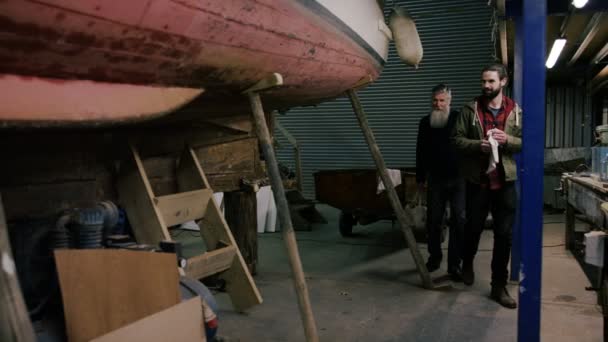 Boatyard Workers Checking Boats Which Have Been Renovated Newly Built — Stock Video