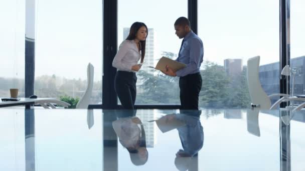 Business Man Woman Discussing Paperwork Front Large Office Window — Stock Video