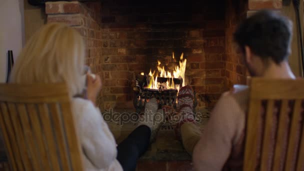 Happy Couple Drinking Hot Drinks Warming Feet Fire — Stock Video